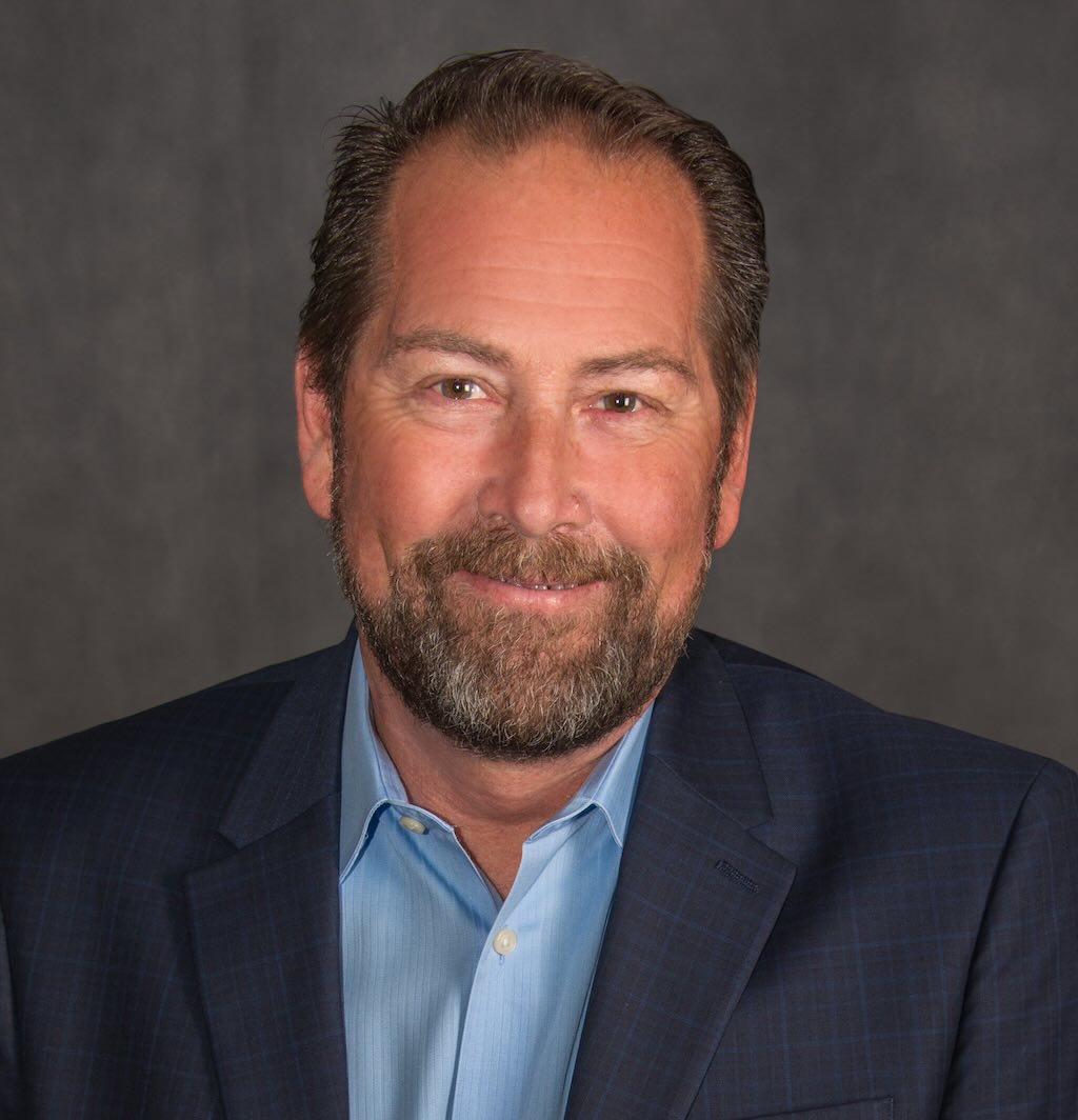 Contra Costa County Board of Supervisors District 4 candidate Ken Carlson Image credit: Ken Carlson Man in a blue suit smiles at the camera