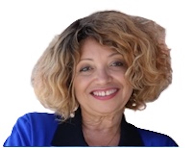 East Palo Alto at Large: Deborah Lewis-Virges. Woman in a blue-black blouse, smiling. Photo credit: Deborah Lewis-Virges, used with permission.