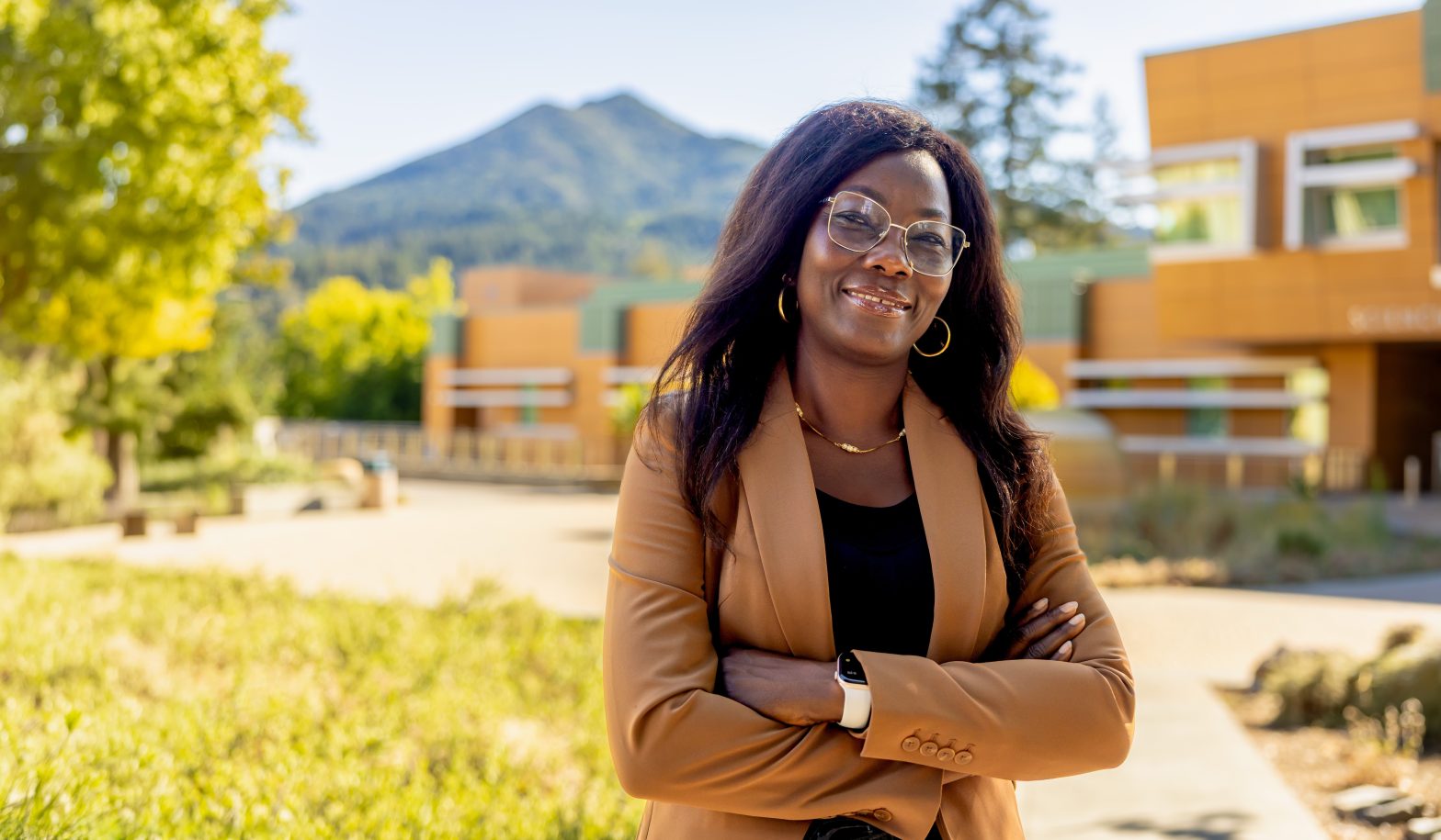 Jackie Elward for California State Assembly District 12. Woman stands outside with mountain in the distance. Photo credit: Jackie Elward for Assembly, used with permission.