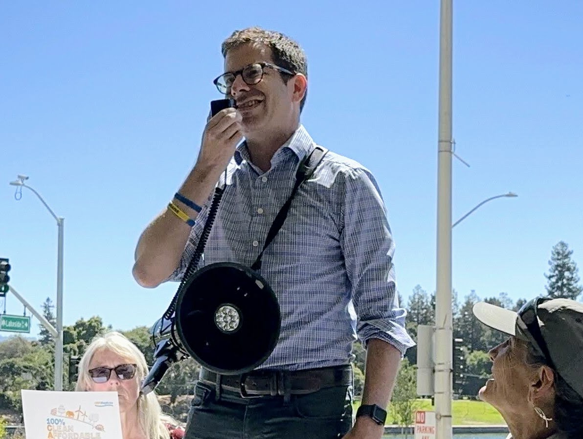 Berkeley City Council District 4: Igor Tregub Man at gathering speaking into a mic. Photo credit: Igor Tregub's campaign, used with permission
