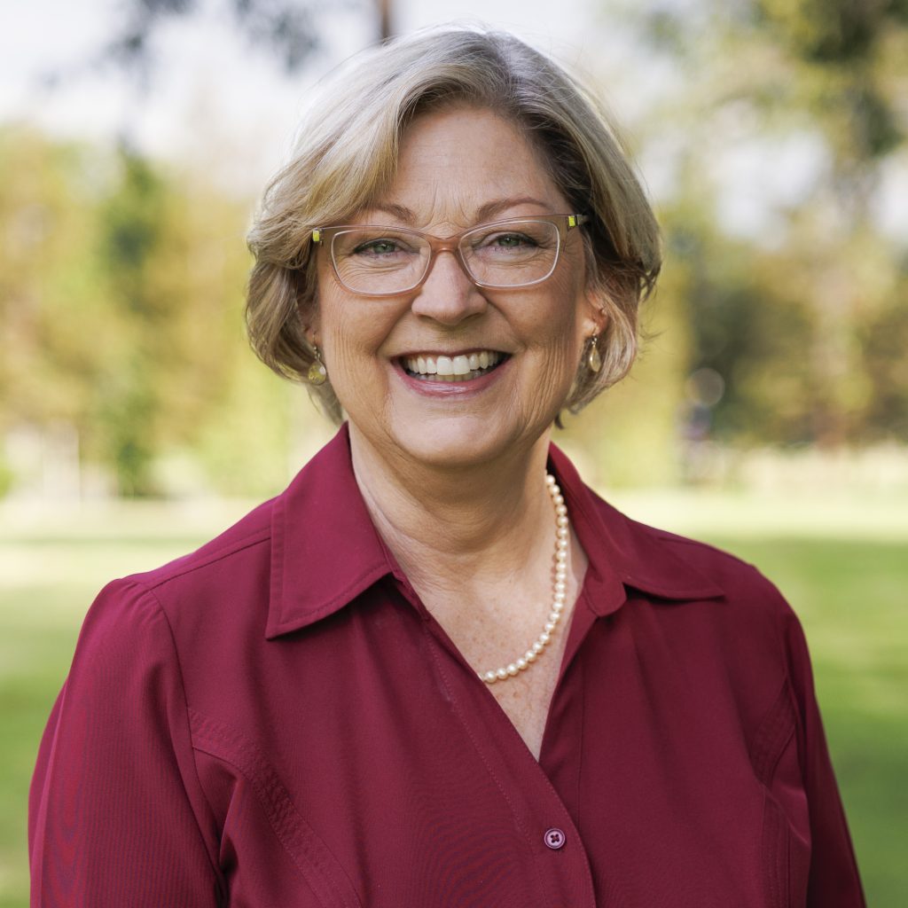 Laura Nakamura for Concord City Council District 5. Woman in a dark red blouse, smiling. Photo credit: Laura Nakamura, used with permission