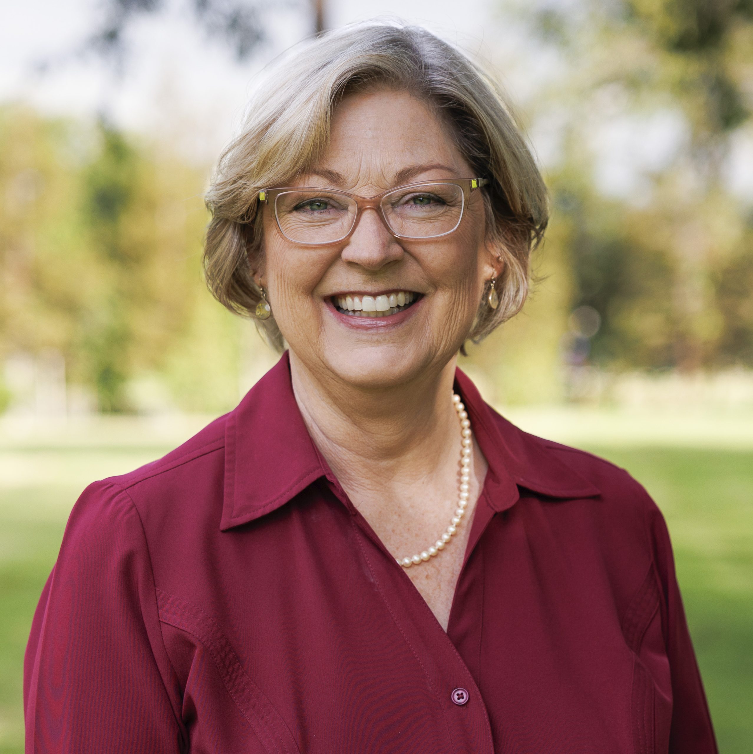 Laura Nakamura for Concord City Council District 5. Woman in a dark red blouse, smiling. Photo credit: Laura Nakamura, used with permission