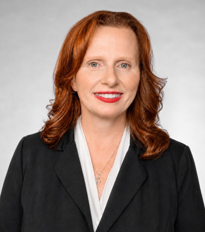 Maria Bagley for Concord City Council District 1. Woman with red hair and blue-grey eyes smiling. Photo credit: Maria Bagley, used with permission