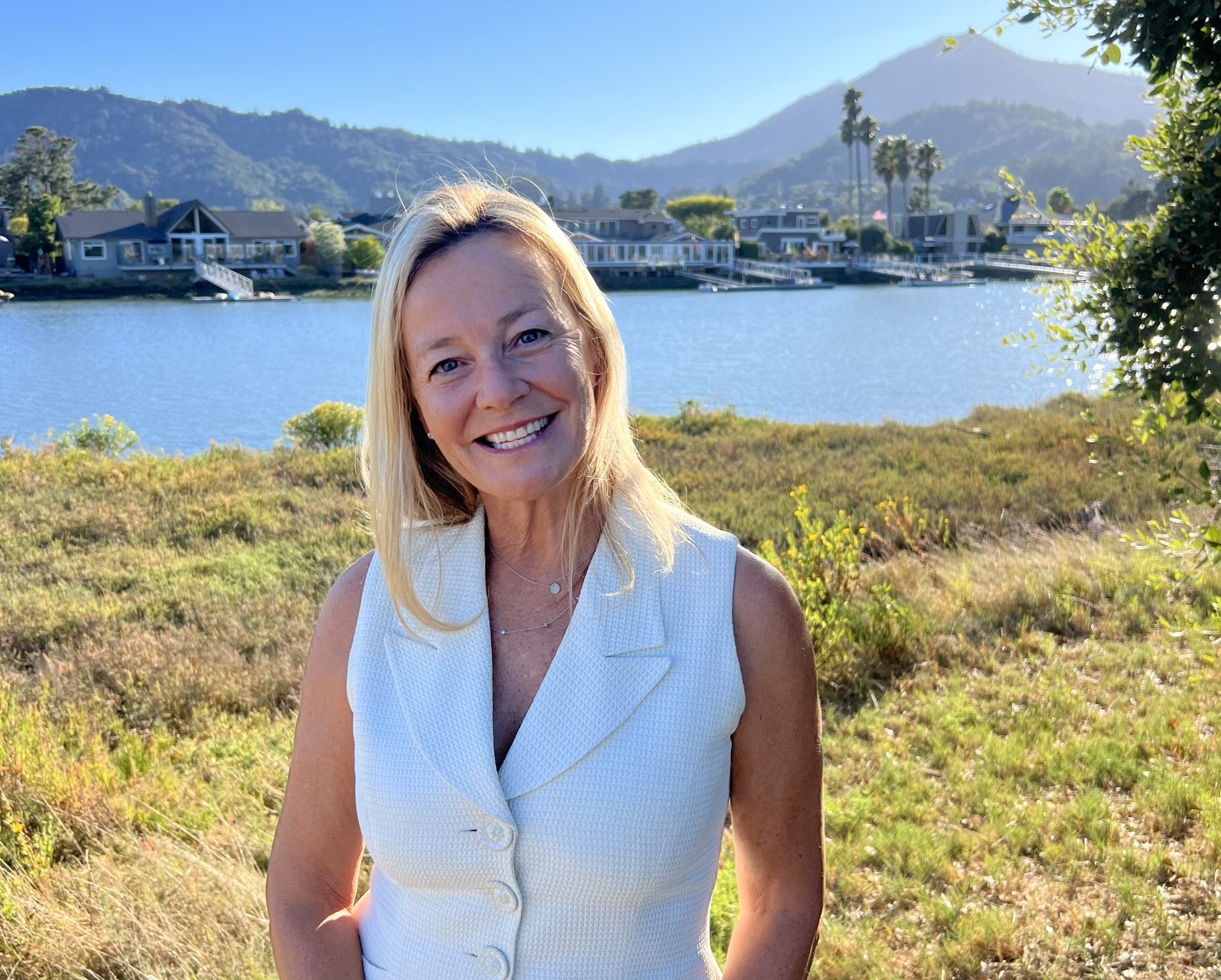 Larkspur City Council At Large: Sarah Margulies. Picture of woman smiling in white dress. Image credit: Sarah Margulies, used with permission