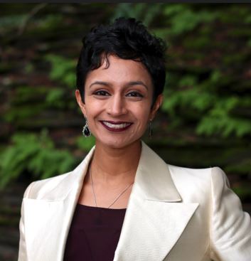 Janani Ramachandran for Oakland City Council district 4. Woman with short, black hair and cream colored jacket, smiling. Photo credit: Janani Ramachandran campaign, used with permission.